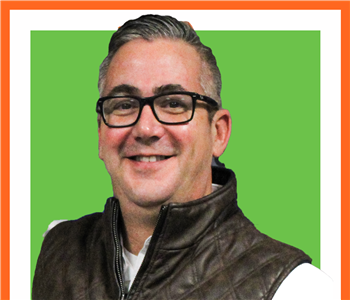 Norm Perkins- Male Employee - white wall- SERVPRO