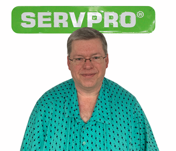 Ron, male, SERVPRO employee, cut out, against a white background, SERVPRO green sign above head